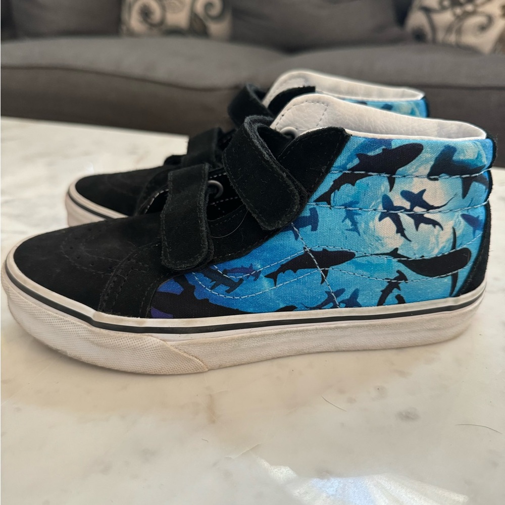 Big boys size 3 Vans. High tops with sharks. Worn maybe 3-5 times. Like new.